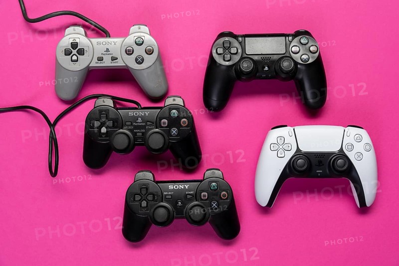 Different generations of game controllers of the Playstation game console