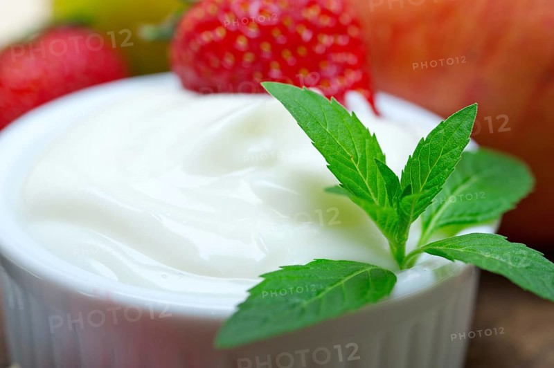 Fresh fruits and whole milk yogurt on a rustic wood table