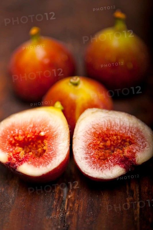 Fresh figs macro closeup over old wood boards