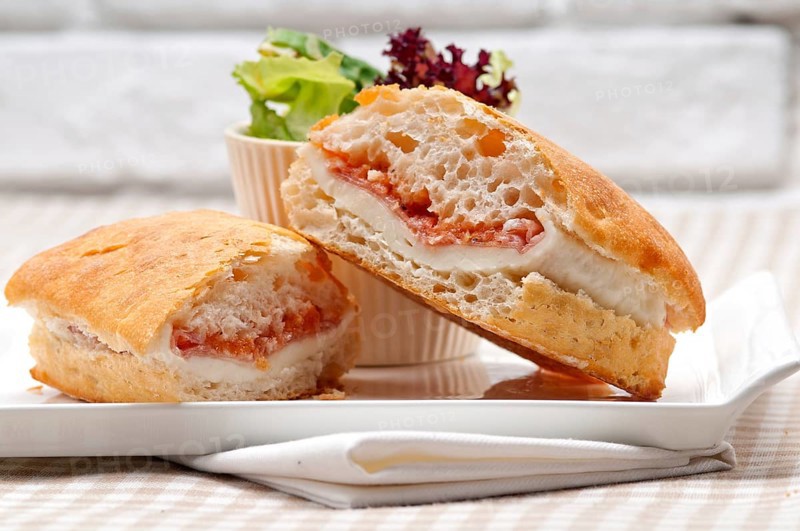 Italian ciabatta panini sandwich with parma ham and tomato