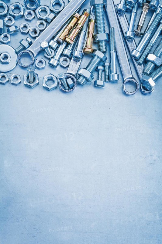 Large set of stainless steel repair tools on metallic background copyspace image construction concept