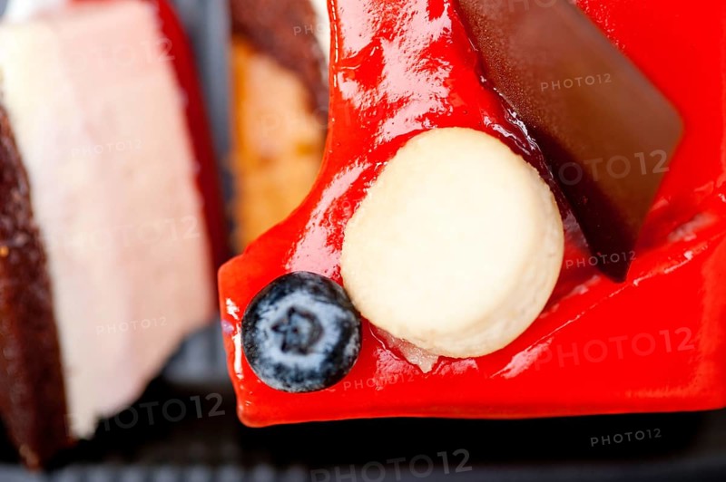 Fresh strawberry yogurt mousse with macaroon and blueberry on top