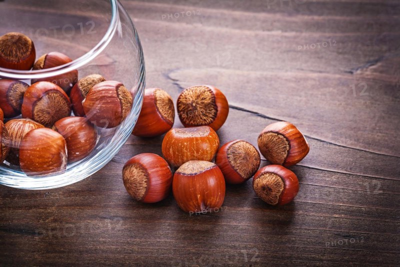 Food and drink concept Stack of hazelnuts in glass jar