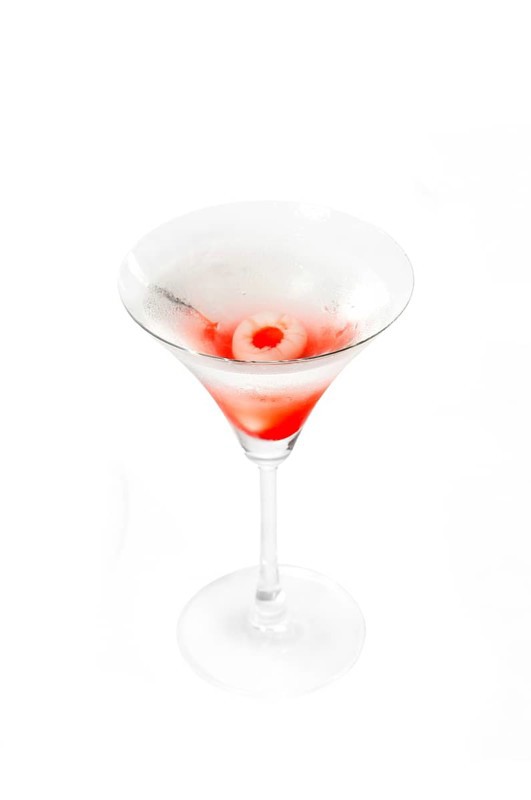 Lychee martini cocktail straight up isolated on white background