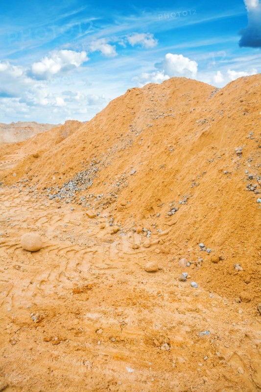View of the pile of building sand and the sky