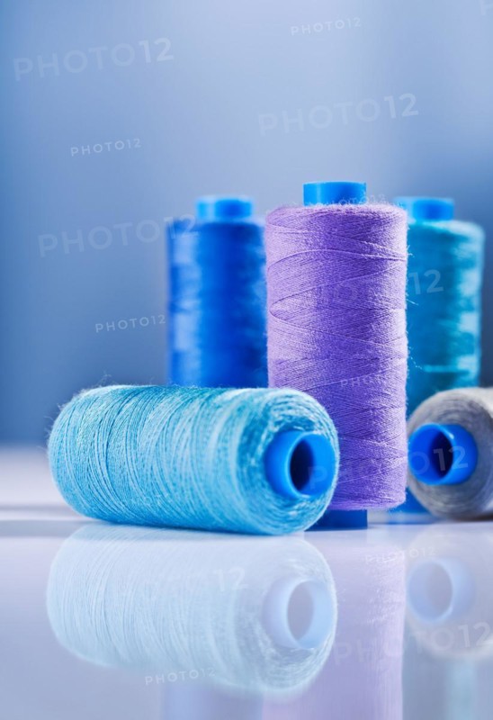 Five sewing bobbins