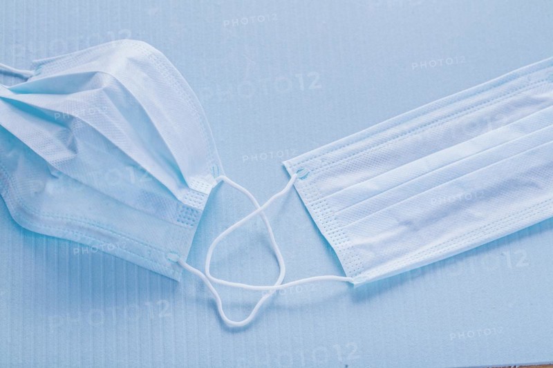 Medical concept Disposable face masks on a blue background