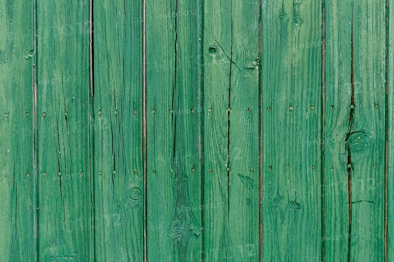 Old wooden door with aged metal door handle. Architectural textured background