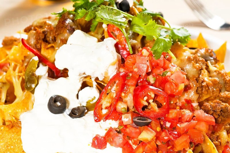 Fresh nachos and vegetable salad with meat
