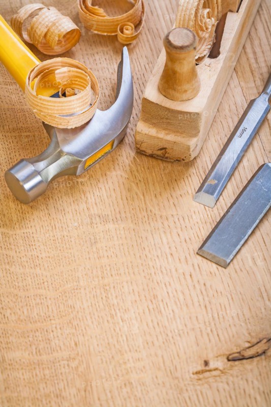Chisel hammer Joiner's plane on wooden board