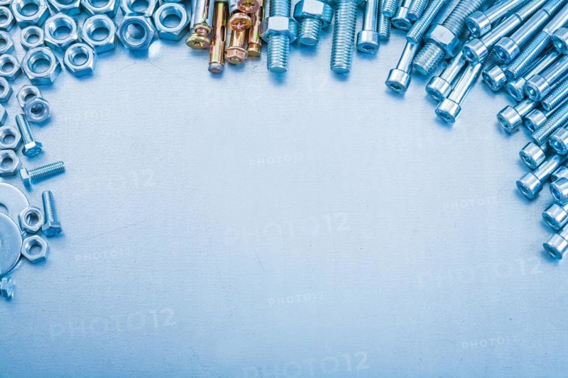 Metallic background with stack of metal tools with thread design concept