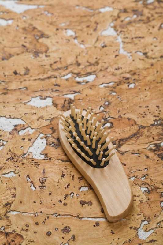 Hairbrush on cork wood
