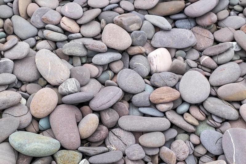 Various flat stones rounded by the sea