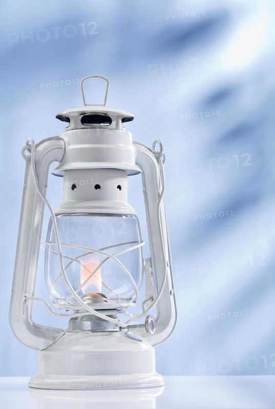 Paraffin lamp on a blue background