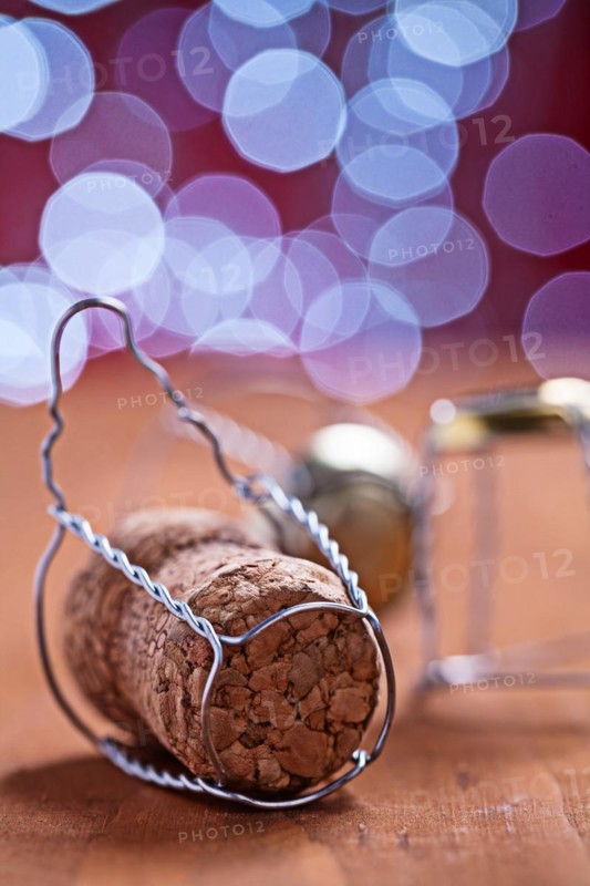 Champagne cork on wooden table close-up