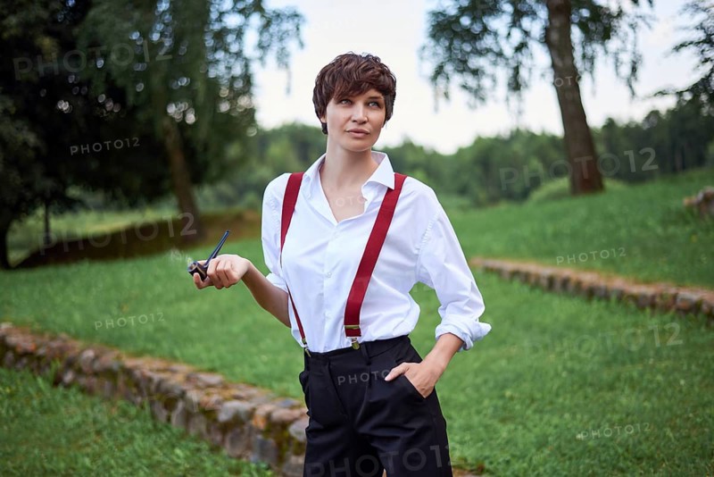 Image of a stylish beautiful woman in a white shirt