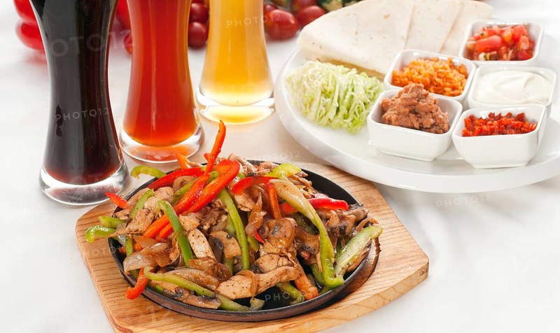 Original fajita sizzling smoking hot served on iron plate