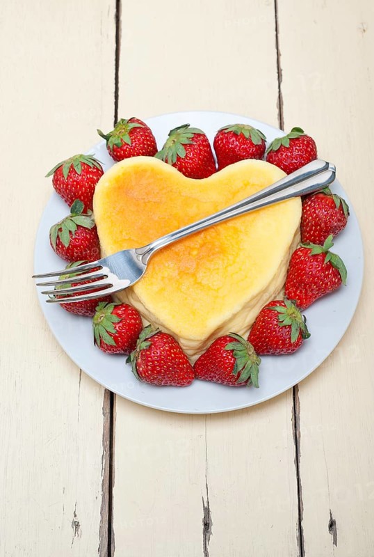 Heart shaped cheesecake with strawberryes ideal cake for valentine day