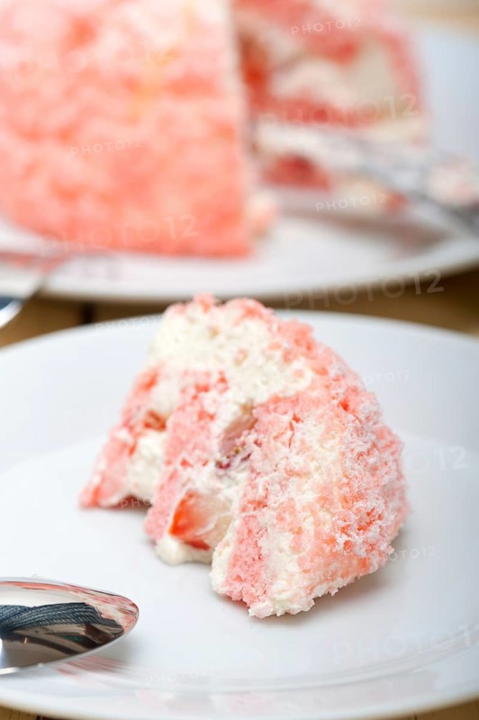 Fresh pink strawberry and whipped cream dessert macro close up