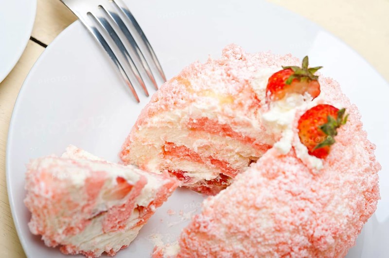 Fresh pink strawberry and whipped cream dessert macro close up