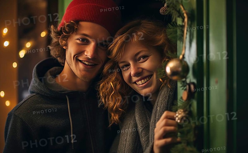 Young couple smiling together near home door decorated with mistletoe. Christmas holidays Ai generated