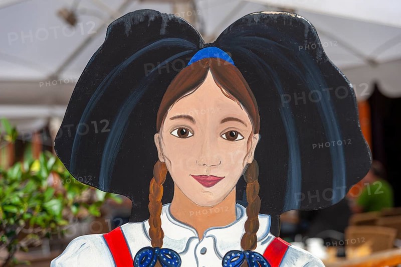 Wooden figure of a woman in traditional traditional costume