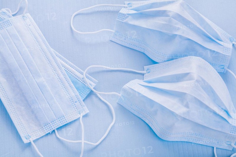 Medical surgical flu disease protective face masks textile filter on blue background