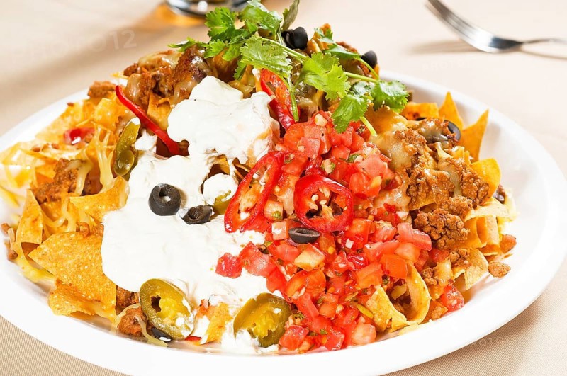 Fresh nachos and vegetable salad with meat