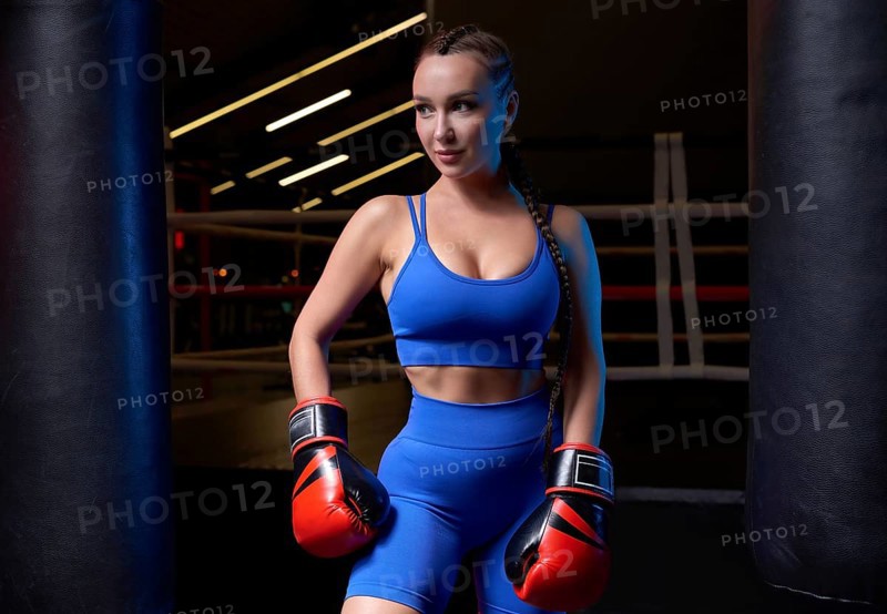 Woman boxer in red gloves. Sports concept