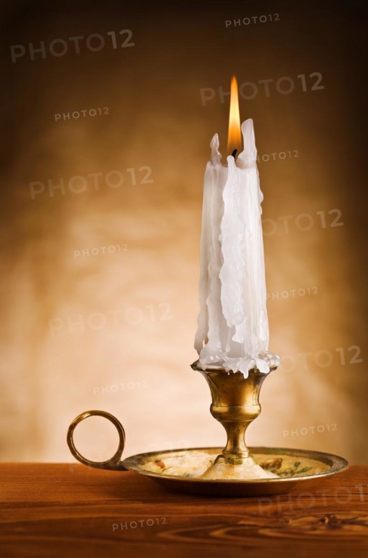 Copy the image of a burning candle in an old candlestick