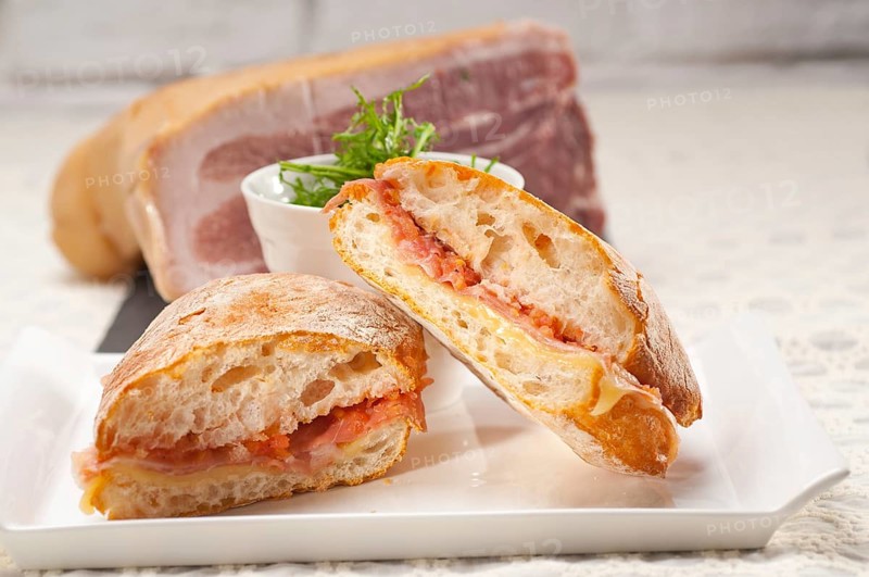 Italian ciabatta panini sandwich with parma ham and tomato
