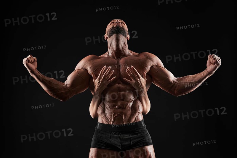 Perfect abdomen. Female hands embracing