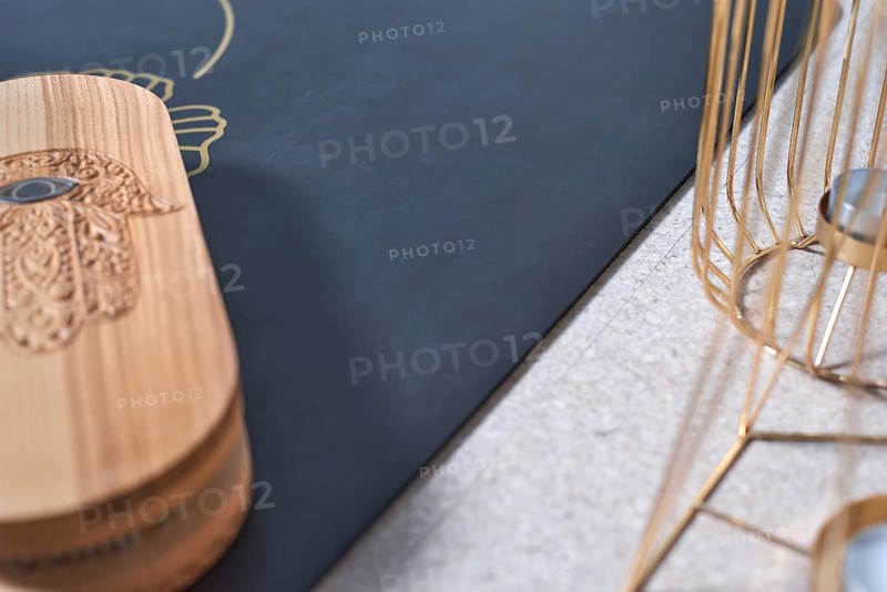 Image of a box with nails in a light studio on a black mat. Yoga concept. Spiritual practices. Mixed media