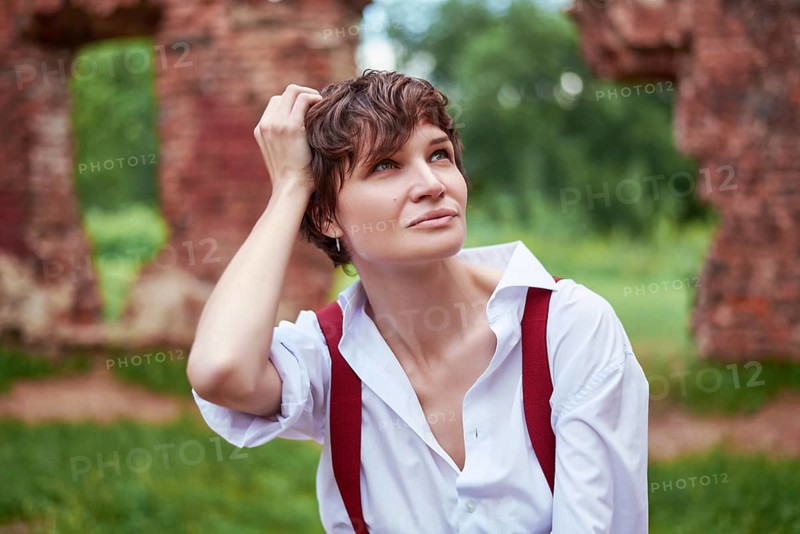 Image of a stylish beautiful woman in a white shirt