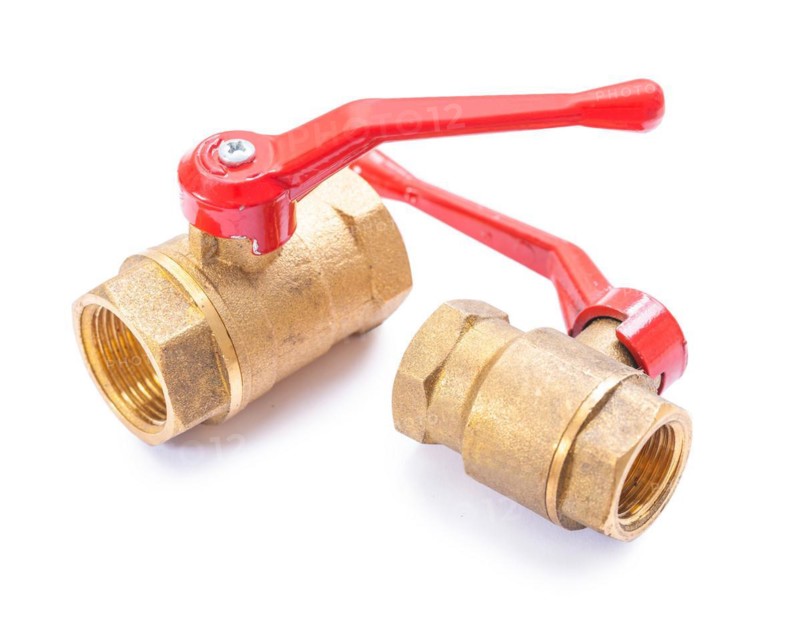 Brass sanitary fittings against a white background