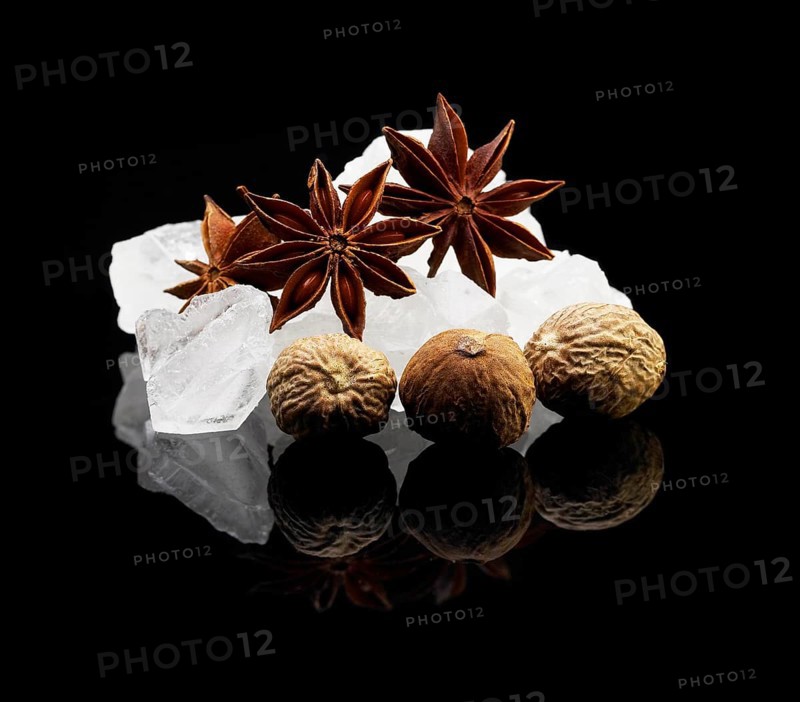 Crystal sugar over black reflective surface background
