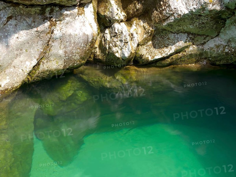 Emerald green Soca River with crystal clear water