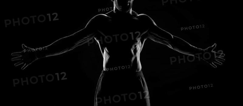 Noname image of a kickboxer on a dark background. The concept of mixed martial arts. MMA