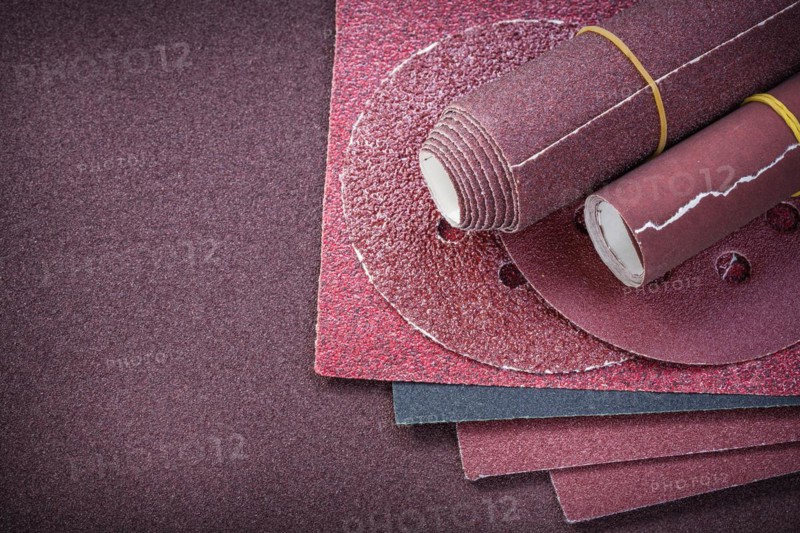 Assortment of abrasive equipment on polishing paper