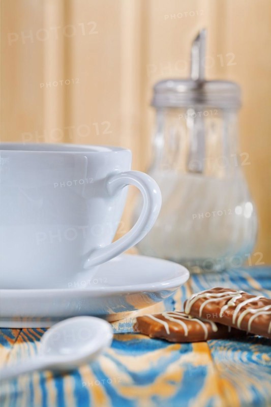 Cup dispenser and biscuits