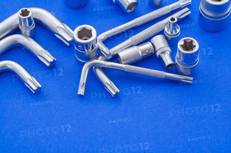 Hexagon spanner and Torx on blue background