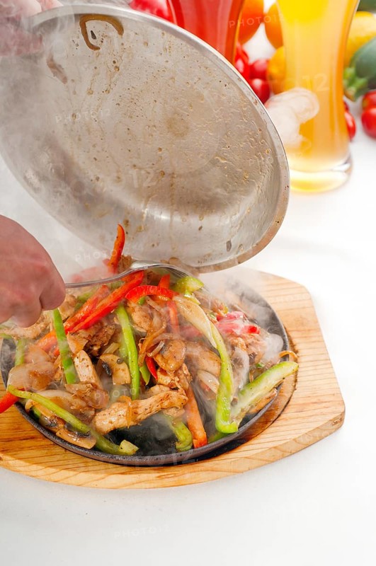Original fajita sizzling smoking hot served on iron plate