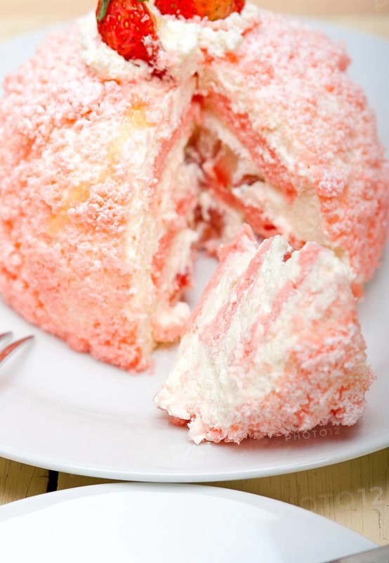 Fresh pink strawberry and whipped cream dessert macro close up