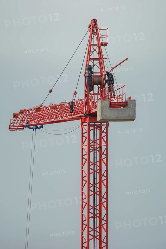 Professional crane operator inspecting the crane at high altitude