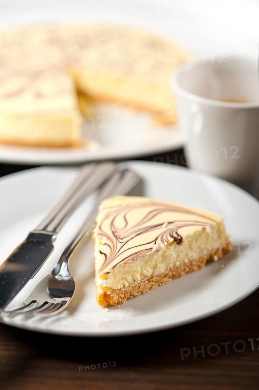 Fresh baked classic Cheese cake with chocolate topping and espresso coffee