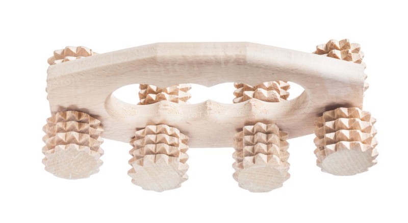 Big wooden massager isolated on white