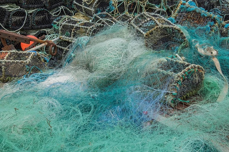 Turquoise fishing net and lobster baskets