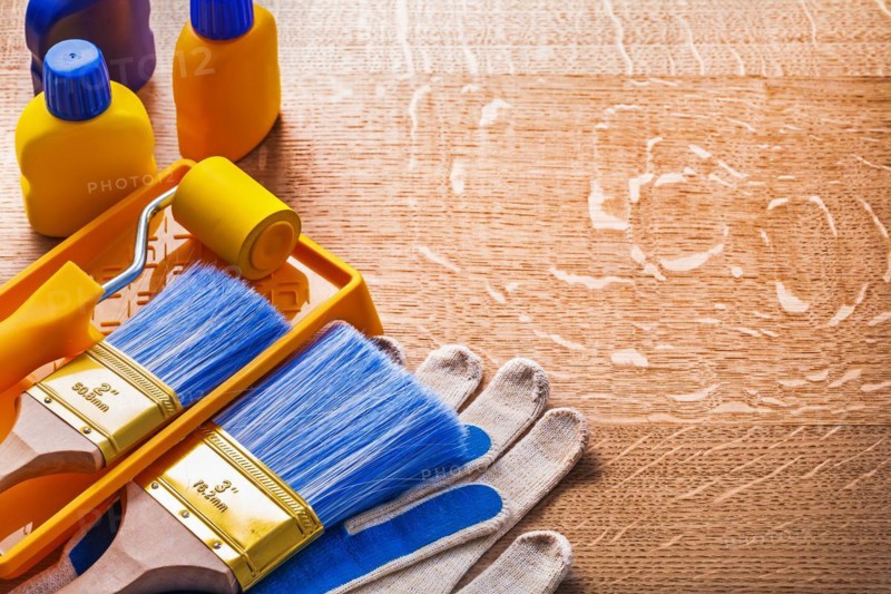 Home improvement paint tools on wooden board construction concept