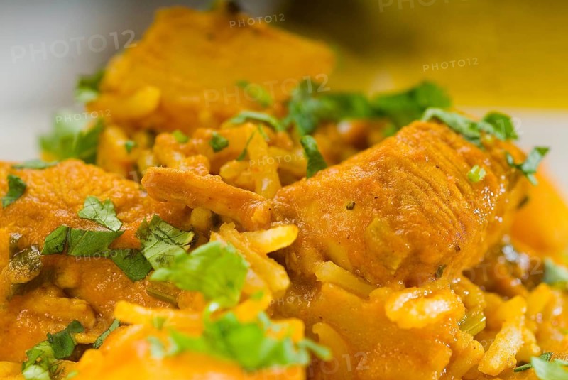 Fresh home made curry beef rice and potatoes with ingredients around composition