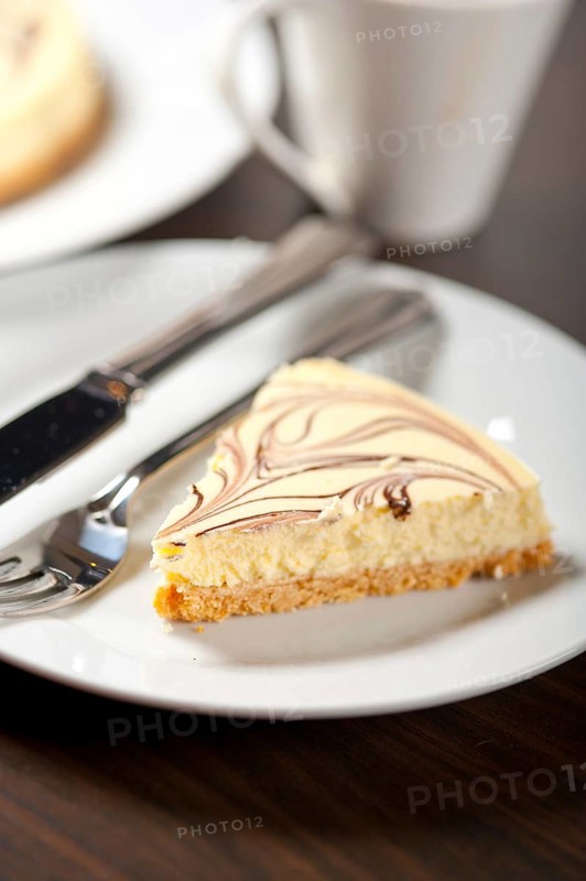 Fresh baked classic Cheese cake with chocolate topping and espresso coffee
